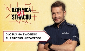 Na zdjęciu policjant oraz hasło akcji &quot;Dzielnica bez strachu&quot;